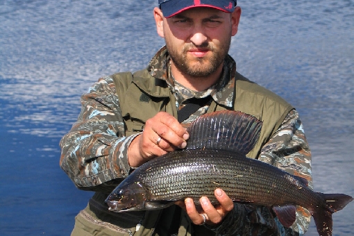Ingmars Birkovs, Latvia, with an IGFA 6 lb line world record grayling, 1.8 kg, from River Lätäseno.