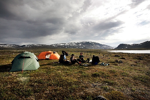 During wilderness fishing trip anglers sleep in tents. Enontekiö.